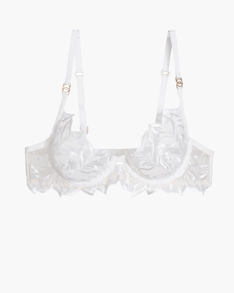 White embroidered lace bra with adjustable straps and underwire, featuring a delicate floral design.