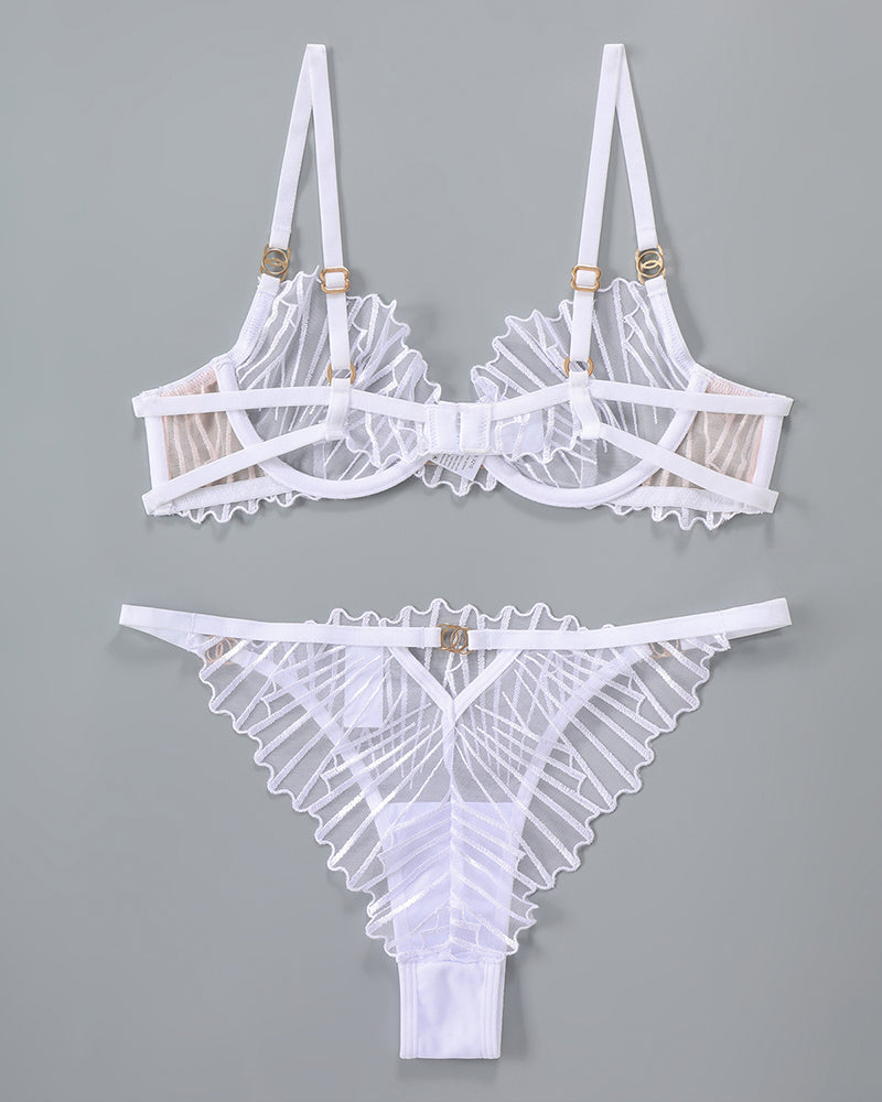 White embroidered lingerie set. Adjustable straps, underwire bra, delicate lace details.