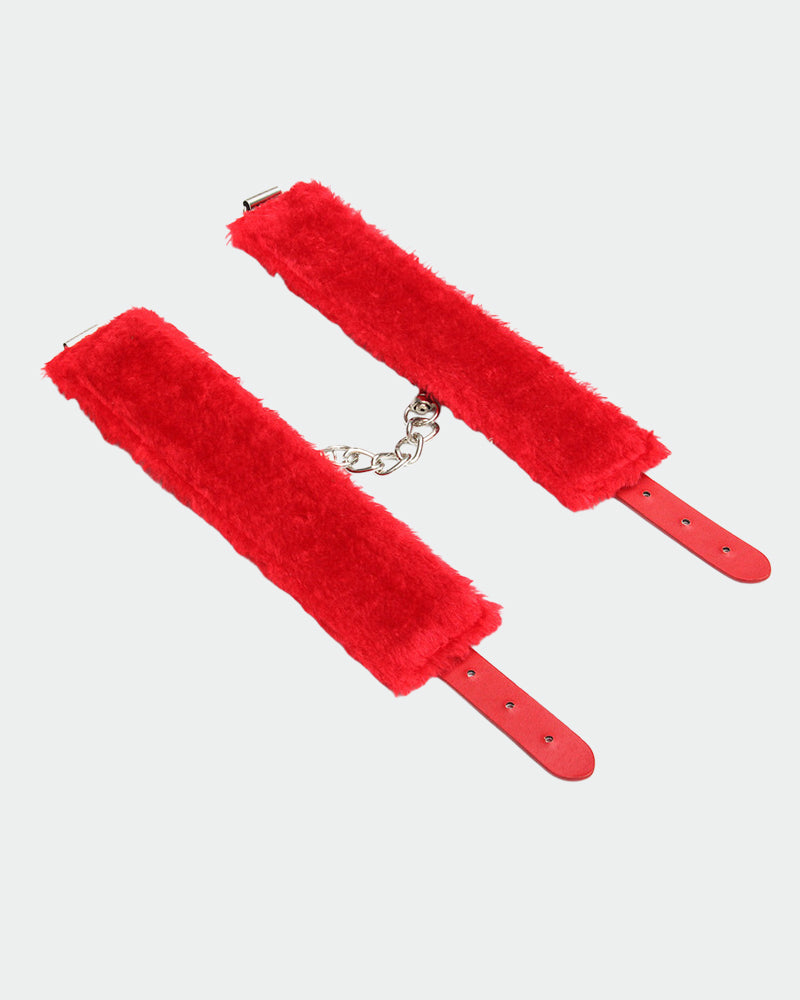 Red plush leather handcuffs with silver chain, perfect for role play and intimate moments.