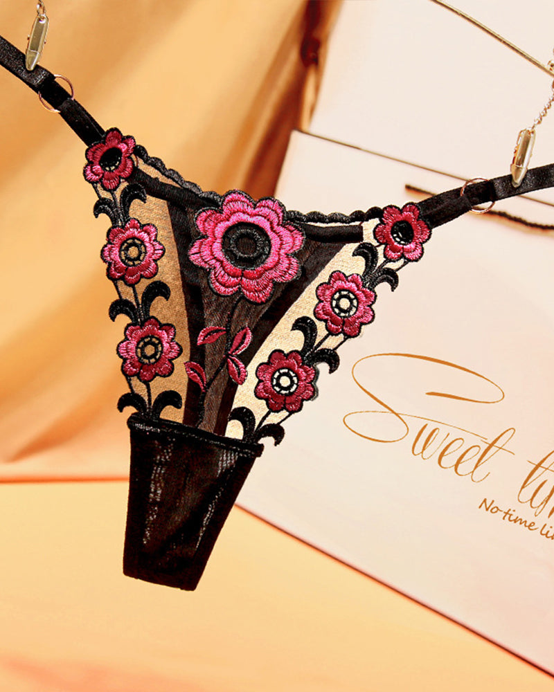 Embroidered black lace thong panties with pink flowers. Sexy low waist lingerie.