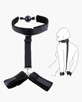 Black adjustable strap set with mouth gag and wrist restraints for intimate sessions