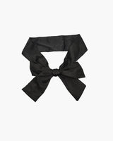 Black satin eye mask kit, adjustable for meditation, travel, or romantic use. Soft, elegant design.