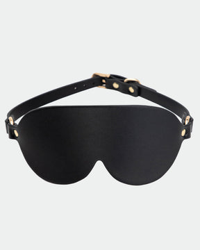 Black leather sunshade eye mask with adjustable strap and gold hardware for intimate sessions.
