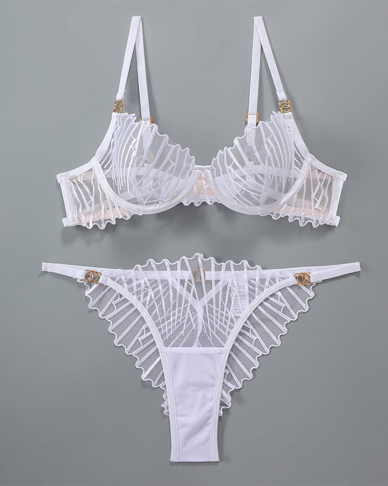 White lace lingerie set with adjustable straps and embroidered details, sweet yet seductive.