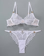 White lace lingerie set with adjustable straps and embroidered details, sweet yet seductive.