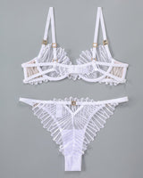 White embroidered lingerie set. Adjustable straps, underwire bra, delicate lace details.