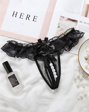 Black beaded lace crotchless panty with faux pearls, low rise design, and strap accent