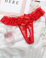 Red lace crotchless panty with faux pearls and bow accents, low rise design, and delicate lace trim