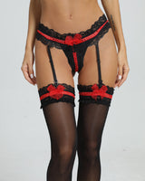 Black lace lingerie set with red accents, knee-high stockings and garter belt