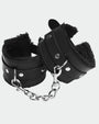 Black plush leather handcuffs with silver chain, perfect for role play and intimate moments.