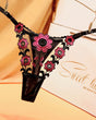 Embroidered black lace thong panties with pink flowers. Sexy low waist lingerie.