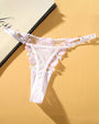 White low waist thong panties with pink floral embroidery, sexy lingerie with adjustable straps.