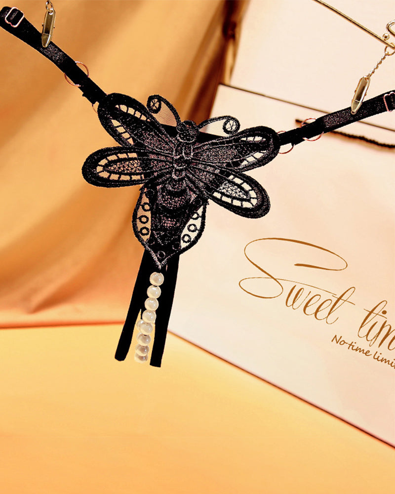 Black butterfly embroidered crotchless thong with pearl accents, perfect for a sweet time.