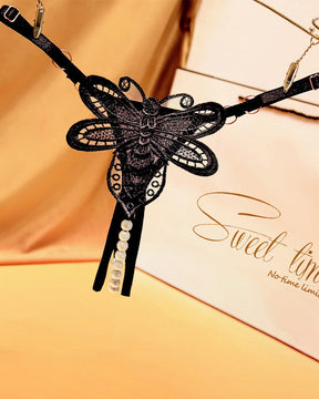 Black butterfly embroidered crotchless thong with pearl accents, perfect for a sweet time.
