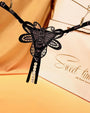 Black butterfly embroidered crotchless thong with pearl accents, perfect for a sweet time.