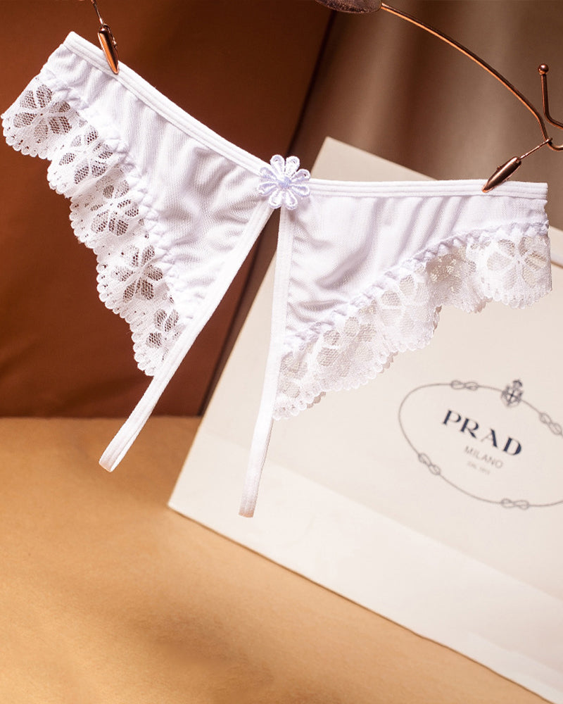 White lace crotchless thong with floral design, low waist, Prada shopping bag