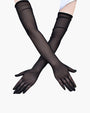 Black sheer elbow-length gloves. Adds elegance and mystery to any outfit.